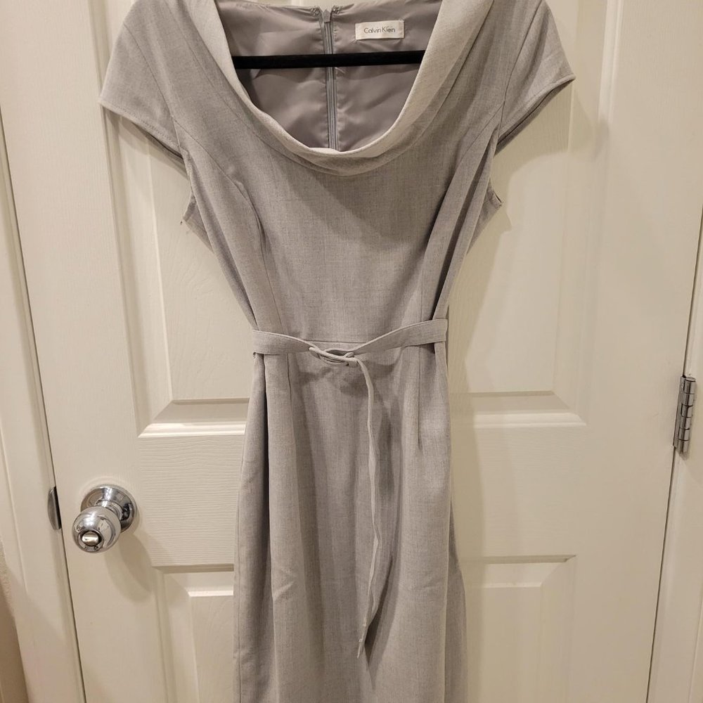 Gray cowlneck belted dress.
